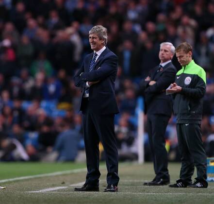 Manchester City s Manuel Pellegrini looks on dejected League Cup Fourth Round- Manchester City vs Newcastle United - Etihad Stadium - England - 29th October 2014 - EDITORIAL USE ONLY. No use with unauthorised audio, video, data, fixture lists, club league logos or live services. Online in-match use limited to 120 images, no video emulation. No use in betting, games or single club league player publications.