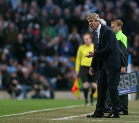 Manchester City s Manuel Pellegrini looks on dejected League Cup Fourth Round- Manchester City vs Newcastle United - Etihad Stadium - England - 29th October 2014 - EDITORIAL USE ONLY. No use with unauthorised audio, video, data, fixture lists, club league logos or live services. Online in-match use limited to 120 images, no video emulation. No use in betting, games or single club league player publications.