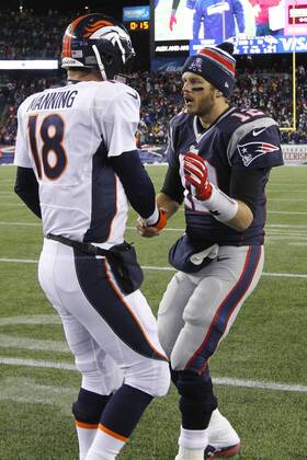 New England Patriots quarterback Tom Brady (12) shakes hands with Denver Broncos quarterback Peyton Manning (18) after the Patriots defeated the Broncos 43-21 at Gillette Stadium in Foxboro, Massachusetts on November 2, 2014.  BOS2014110210