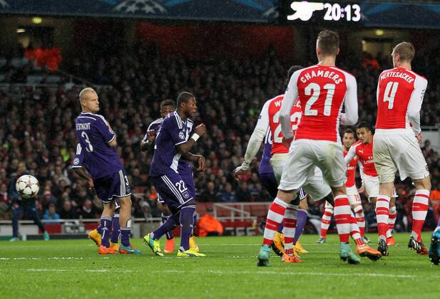 Arsenal s Alexis Sanchez scoring his sides second goal - Champions League Group D - Arsenal vs Anderlecht- Emirates Stadium - London - England - 4th November 2014 - Picture David Klein Sportimage EDITORIAL USE ONLY. No use with unauthorised audio, video, data, fixture lists, club league logos or live services. Online in-match use limited to 120 images, no video emulation. No use in betting, games or single club league player publications.