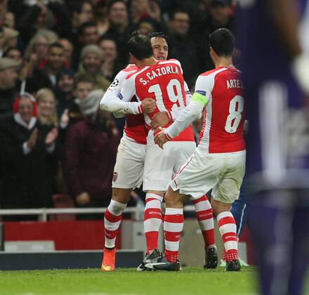 Arsenal s Alexis Sanchez celebrates scoring his sides second goal - Champions League Group D - Arsenal vs Anderlecht- Emirates Stadium - London - England - 4th November 2014 - Picture David Klein Sportimage EDITORIAL USE ONLY. No use with unauthorised audio, video, data, fixture lists, club league logos or live services. Online in-match use limited to 120 images, no video emulation. No use in betting, games or single club league player publications.
