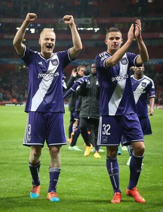 - LONDON, ENGLAND: Anderlecht s Olivier Deschacht and Anderlecht s Leander Dendoncker celebrate after the match between English team Arsenal and Belgian RSCA Anderlecht in the Emirates stadium in London, England, Tuesday 04 November 2014, on the fourth day of the group stage of the UEFA Champions League competition, in the group D. VIRGINIExLEFOUR  premiumd 20190906