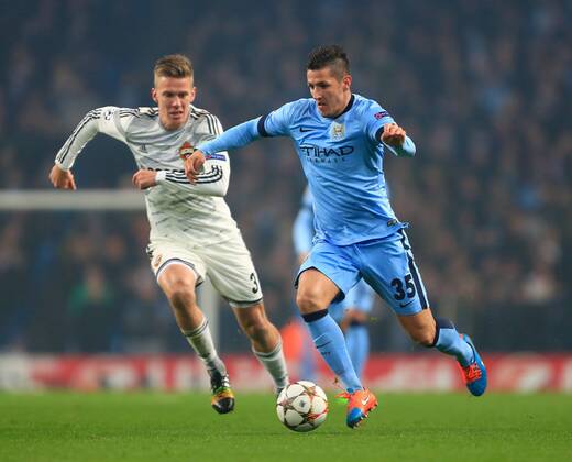 Aktuell Fussball, Champions League, Manchester City - ZSKA Moskau 3 Stevan Jovetic of Manchester City skips past a challenge from Pontus Wernbloom of CSKA - Manchester City vs. CSKA Moscow - UEFA Champions League - Etihad Stadium - Manchester - 05 11 2014 Pic Philip Oldham Sportimage EDITORIAL USE ONLY. No use with unauthorised audio, video, data, fixture lists, club league logos or live services. Online in-match use limited to 120 images, no video emulation. No use in betting, games or single club league player publications.