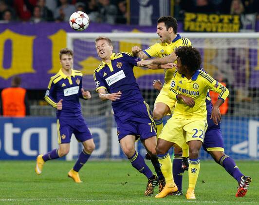 SOCCER - CL, Maribor vs Chelsea MARIBOR,SLOVENIA,05.NOV.14 - SOCCER - UEFA Champions League, group stage, NK Maribor vs Chelsea FC. Image shows Ales Mertelj (Maribor), Cesc Fabregas and Willian (Chelsea). 