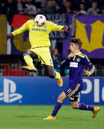 SOCCER - CL, Maribor vs Chelsea MARIBOR,SLOVENIA,05.NOV.14 - SOCCER - UEFA Champions League, group stage, NK Maribor vs Chelsea FC. Image shows Kurt Zouma (Chelsea) and Luka Zahovic (Maribor). 