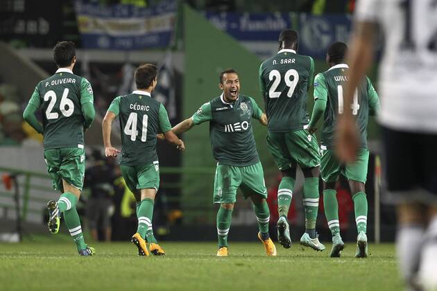 Sporting s defender Jefferson Nascimento (C) celebrates after scoring a goal during a soccer match between Portugal s Sporting CP and Germany s FC Schalke 04 for the group stage of the UEFA Champions League, in Sporting s Alvalade Stadium in Lisbon, on November 5, 2014. Portugal: UEFA Champions League: Sporting Vs Schalke 04 