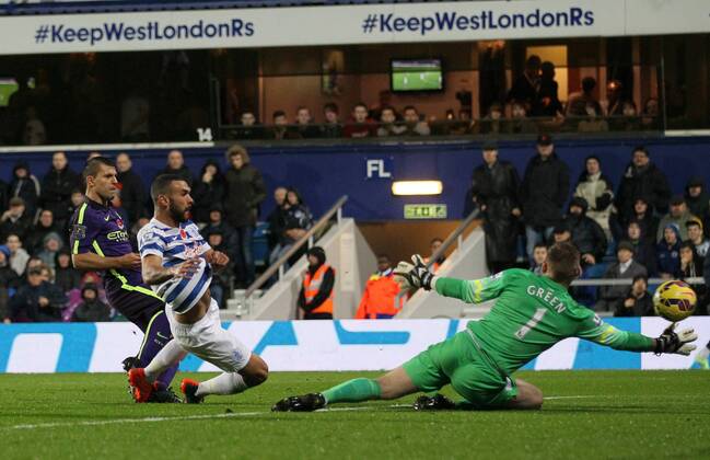 Manchester City s Sergio Kun Agüero scoring his sides opening goal - Barclays Premier League - Queens Park Rangers vs Manchester City- Loftus Road - London - England - 8th November 2014 - Picture David Klein Sportimage EDITORIAL USE ONLY. No use with unauthorised audio, video, data, fixture lists, club league logos or live services. Online in-match use limited to 120 images, no video emulation. No use in betting, games or single club league player publications.