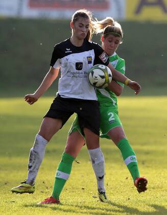 SOCCER - CL, Neulengbach vs Wolfsburg NEULENGBACH,AUSTRIA,09.NOV.14 - SOCCER - UEFA Champions League, Women, NOESV Neulengbach vs VfL Wolfsburg. Image shows Jelena Prvulovic (Neulengbach) and Luisa Wensing (Wolfsburg). 