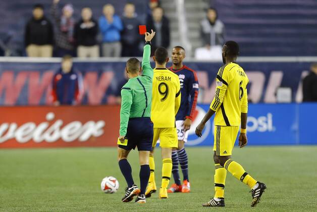 November 9, 2014: Referee Armando Villarreal issues a second yellow and subsequent red card to Columbus Crew s Justin Meram (9). The New England Revolution defeated the Columbus Crew 3-1 in the second leg of the Major League Soccer Eastern Conference Semi-Finals at Gillette Stadium in Foxborough, Massachusetts. The Revolution win on aggregate goals 7-3 to advance to the Eastern Conference Finals. SOCCER: NOV 09 MLS Fussball Herren USA - Eastern Conference Semifinal - Crew SC at Revolution Icon20149886 EDITORIAL USE ONLY