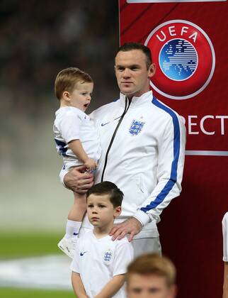 England s Wayne Rooney holds his sons Klay and Kai - International European Qualifier - England vs Slovenia- Wembley Stadium - London - England - 15th November 2014 - Picture David Klein Sportimage EDITORIAL USE ONLY. No use with unauthorised audio, video, data, fixture lists, club league logos or live services. Online in-match use limited to 120 images, no video emulation. No use in betting, games or single club league player publications.
