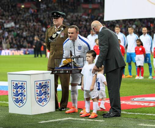England s Wayne Rooney gets presented with his 100th cap - International European Qualifier - England vs Slovenia- Wembley Stadium - London - England - 15th November 2014 - Picture David Klein Sportimage EDITORIAL USE ONLY. No use with unauthorised audio, video, data, fixture lists, club league logos or live services. Online in-match use limited to 120 images, no video emulation. No use in betting, games or single club league player publications.