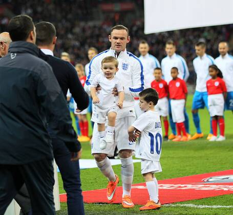England s Wayne Rooney holds his sons Klay and Kai - International European Qualifier - England vs Slovenia- Wembley Stadium - London - England - 15th November 2014 - Picture David Klein Sportimage EDITORIAL USE ONLY. No use with unauthorised audio, video, data, fixture lists, club league logos or live services. Online in-match use limited to 120 images, no video emulation. No use in betting, games or single club league player publications.