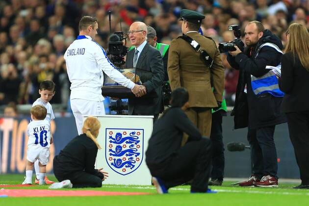 Sir Bobby Charlton presents Wayne Rooney of England with his 100th cap - England - EM Quali - Wembley Stadium - London - 15 11 2014 Pic PhilipxOldham Sportimage EDITORIAL USE ONLY. No use with unauthorised audio, video, data, fixture lists, club league logos or live services. Online in-match use limited to 120 images, no video emulation. No use in betting, games or single club league player publications.