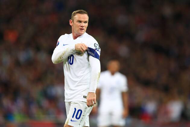 Wayne Rooney of England tugs at his captain s armband - England vs. Slovenia - UEFA Euro 2016 Qualifying - Wembley Stadium - London - 15 11 2014 Pic Philip Oldham Sportimage EDITORIAL USE ONLY. No use with unauthorised audio, video, data, fixture lists, club league logos or live services. Online in-match use limited to 120 images, no video emulation. No use in betting, games or single club league player publications.