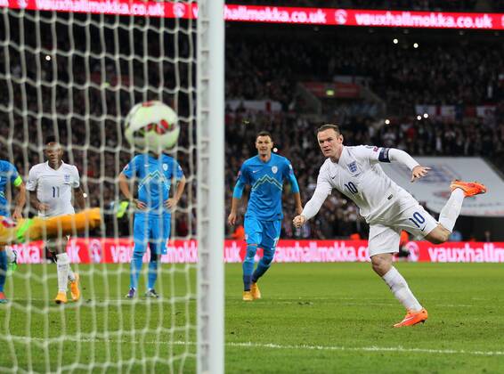 England s Wayne Rooney scoring his sides opening goal - International European Qualifier - England vs Slovenia- Wembley Stadium - London - England - 15th November 2014 - Picture David Klein Sportimage EDITORIAL USE ONLY. No use with unauthorised audio, video, data, fixture lists, club league logos or live services. Online in-match use limited to 120 images, no video emulation. No use in betting, games or single club league player publications.