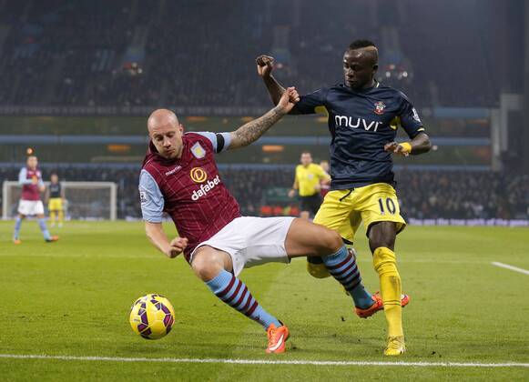 Sadio Mane of Southampton competes withal Hutton of Villa - Football - Barclays Premier League - Aston Villa vs Southampton - Villa Park Birmingham - Season 2014 2015 - 24th November 2015 - Photo Malcolm Couzens Sportimage EDITORIAL USE ONLY. No use with unauthorised audio, video, data, fixture lists, club league logos or live services. Online in-match use limited to 120 images, no video emulation. No use in betting, games or single club league player publications.