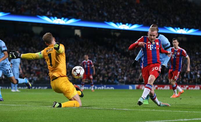 Joe Hart of Manchester City makes early save from Sebastian Rode of Bayern Munich - UEFA Champions League group E - Manchester City vs Bayern Munich - Etihad Stadium - Manchester - England - 25rd November 2014 - Picture Simon Bellis Sportimage EDITORIAL USE ONLY. No use with unauthorised audio, video, data, fixture lists, club league logos or live services. Online in-match use limited to 120 images, no video emulation. No use in betting, games or single club league player publications.
