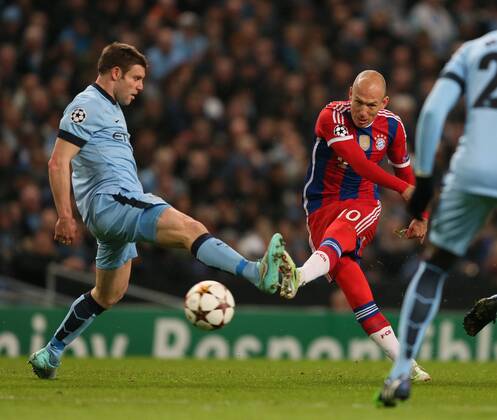 Arjen Robben of Bayern Munich fires in a shot past James Milner of Manchester City - UEFA Champions League group E - Manchester City vs Bayern Munich - Etihad Stadium - Manchester - England - 25rd November 2014 - Picture Simon Bellis Sportimage EDITORIAL USE ONLY. No use with unauthorised audio, video, data, fixture lists, club league logos or live services. Online in-match use limited to 120 images, no video emulation. No use in betting, games or single club league player publications.