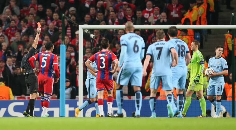 Referee Pavel Kralovec hands out a red card on Mehdi Benatia of Bayern Munich - UEFA Champions League group E - Manchester City vs Bayern Munich - Etihad Stadium - Manchester - England - 25rd November 2014 - Picture Simon Bellis Sportimage EDITORIAL USE ONLY. No use with unauthorised audio, video, data, fixture lists, club league logos or live services. Online in-match use limited to 120 images, no video emulation. No use in betting, games or single club league player publications.