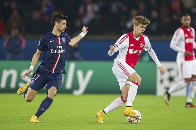(L-R) Javier Pastore of Paris Saint-Germain, Lucas Andersen of Ajax during the UEFA Champions League group F match between Paris Saint-Germain and Ajax Amsterdam on November 24, 2014 at the Parc de Princes stadium in Paris, France. Paris Saint-Germain v Ajax Amsterdam UEFA Champions League Group F 2014 2015 xVIxxIVx 3300946