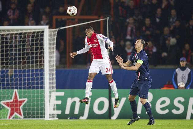 (L-R) Stefano Denswil of Ajax, Zlatan Ibrahimovic of Paris Saint-Germain during the UEFA Champions League group F match between Paris Saint-Germain and Ajax Amsterdam on November 24, 2014 at the Parc de Princes stadium in Paris, France. Paris Saint-Germain v Ajax Amsterdam UEFA Champions League Group F 2014 2015 xVIxxIVx 3300947