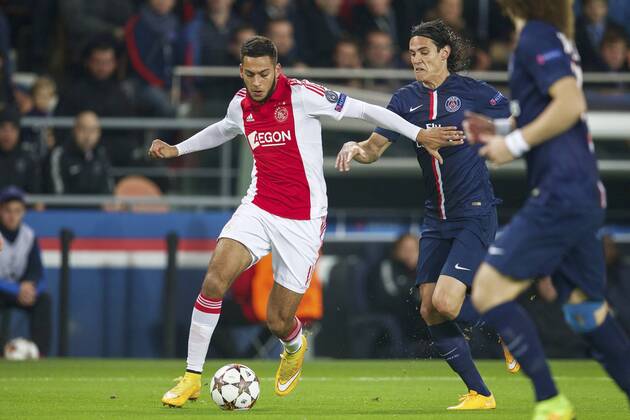 (L-R) Ricardo Kishna of Ajax, Edinson Cavani of Paris Saint-Germain during the UEFA Champions League group F match between Paris Saint-Germain and Ajax Amsterdam on November 24, 2014 at the Parc de Princes stadium in Paris, France. Paris Saint-Germain v Ajax Amsterdam UEFA Champions League Group F 2014 2015 xVIxxIVx 3300948