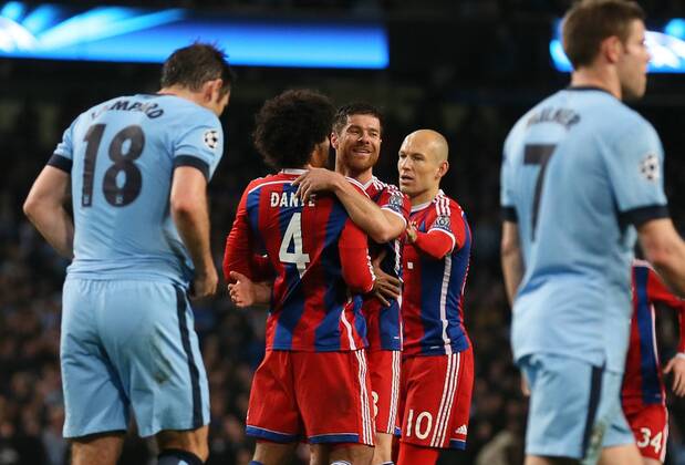 Xabi Alonso of Bayern Munich (c) celebrate his goal - UEFA Champions League group E - Manchester City vs Bayern Munich - Etihad Stadium - Manchester - England - 25rd November 2014 - Picture Simon Bellis Sportimage EDITORIAL USE ONLY. No use with unauthorised audio, video, data, fixture lists, club league logos or live services. Online in-match use limited to 120 images, no video emulation. No use in betting, games or single club league player publications.