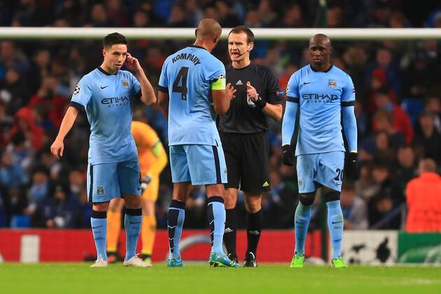 Vincent Kompany of Manchester City questions the referee following Munich s second goal - Manchester City vs. Bayern Munich - UEFA Champion s League - Etihad Stadium - Manchester - 25 11 2014 Pic Philip Oldham Sportimage EDITORIAL USE ONLY. No use with unauthorised audio, video, data, fixture lists, club league logos or live services. Online in-match use limited to 120 images, no video emulation. No use in betting, games or single club league player publications.