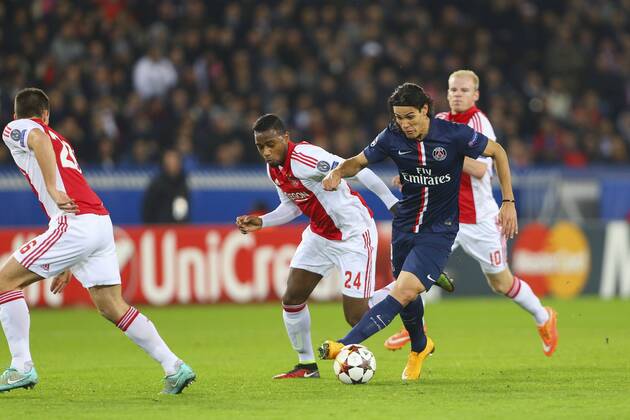 Edinson Cavani (PSG) vs Stefano Denswil (AJAX) FOOTBALL : Paris Saint Germain vs AJAX Amsterdam - Champions League - 25 11 2014 GwendolineLeGoff Panoramic 