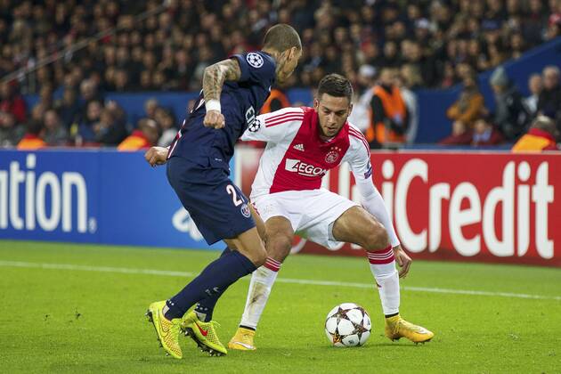 (L-R) Gregory van der Wiel of Paris Saint-Germain, Ricardo Kishna of Ajax during the UEFA Champions League group F match between Paris Saint-Germain and Ajax Amsterdam on November 24, 2014 at the Parc de Princes stadium in Paris, France. Paris Saint-Germain v Ajax Amsterdam UEFA Champions League Group F 2014 2015 xVIxxIVx 3301145