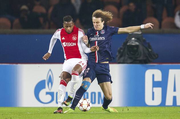 (L-R) Stefano Denswil of Ajax, David Luiz of Paris Saint-Germain during the UEFA Champions League group F match between Paris Saint-Germain and Ajax Amsterdam on November 24, 2014 at the Parc de Princes stadium in Paris, France. Paris Saint-Germain v Ajax Amsterdam UEFA Champions League Group F 2014 2015 xVIxxIVx 3301204