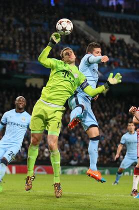 Manuel Neuer of Bayern Munich collects the ball under pressure from Stevan Jovetic of Manchester City - UEFA Champions League group E - Manchester City vs Bayern Munich - Etihad Stadium - Manchester - England - 25rd November 2014 - Picture Simon Bellis Sportimage EDITORIAL USE ONLY. No use with unauthorised audio, video, data, fixture lists, club league logos or live services. Online in-match use limited to 120 images, no video emulation. No use in betting, games or single club league player publications.