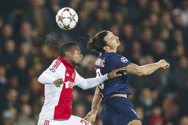 (L-R) Stefano Denswil of Ajax, Zlatan Ibrahimovic of Paris Saint-Germain during the UEFA Champions League group F match between Paris Saint-Germain and Ajax Amsterdam on November 24, 2014 at the Parc de Princes stadium in Paris, France. Paris Saint-Germain v Ajax Amsterdam UEFA Champions League Group F 2014 2015 xVIxxIVx 3301206