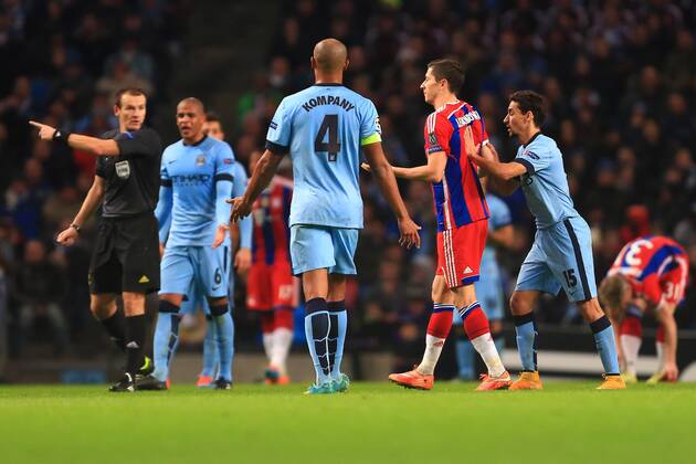 Jesus Navas of Manchester City gives Robert Lewandowski of Munich a push as he is slow to make his way off following substitution - Manchester City vs. Bayern Munich - UEFA Champion s League - Etihad Stadium - Manchester - 25 11 2014 Pic Philip Oldham Sportimage EDITORIAL USE ONLY. No use with unauthorised audio, video, data, fixture lists, club league logos or live services. Online in-match use limited to 120 images, no video emulation. No use in betting, games or single club league player publications.