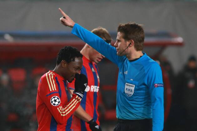 November 25, 2014. Russia, Khimki, arena New Khimki. CSKA s player Ahmed Musa beside referee Felix Brych in the 2014 15 UEFA Champions League s group stage match between CSKA (Moscow, Russia) and AS Roma (Rome, Italy) DmitryxGolubovich 