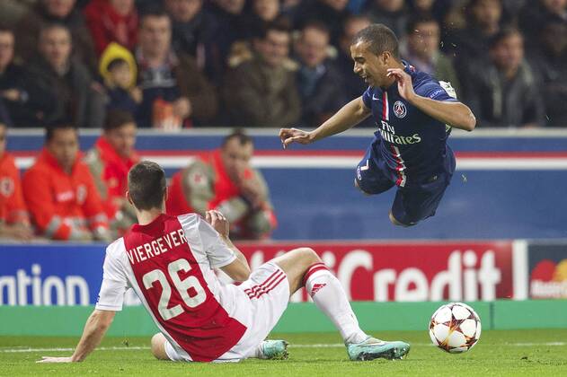 (L-R) Nick Viergever of Ajax, Lucas of Paris Saint-Germain during the UEFA Champions League group F match between Paris Saint-Germain and Ajax Amsterdam on November 24, 2014 at the Parc de Princes stadium in Paris, France. Paris Saint-Germain v Ajax Amsterdam UEFA Champions League Group F 2014 2015 xVIxxIVx 3301581
