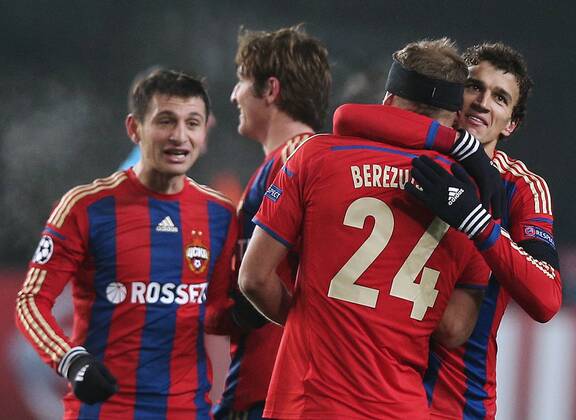 MOSCOW REGION, RUSSIA. NOVEMBER 25, 2014. CSKA s Alan Dzagoev, Mario Fernandes, Vasily Berezutsky, and Roman Yeryomenko (L-R) celebrate scoring in their 2014 15 Season UEFA Champions League Group E Round 5 football match against Roma at Arena Khimki Stadium. The game ended in a 1:1 draw. ArtyomxKorotayev TASS  premiumd RE155CF4