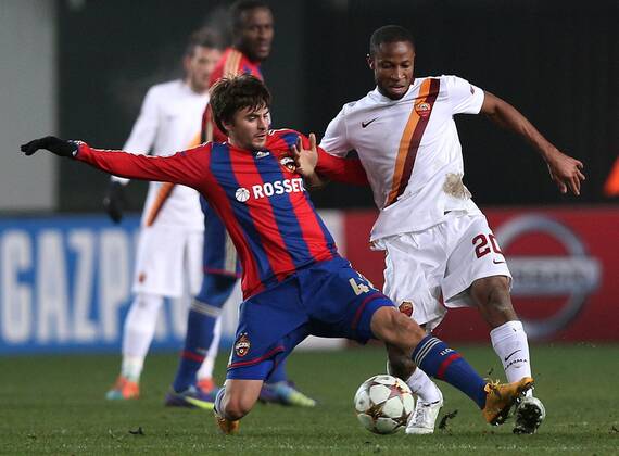 MOSCOW REGION, RUSSIA. NOVEMBER 25, 2014. CSKA s Georgy Shchennikov (L) and Roma s Seydou Keita fight for the ball in their 2014 15 Season UEFA Champions League Group E Round 5 football match at Arena Khimki Stadium. The game ended in a 1:1 draw. ArtyomxKorotayev TASS  premiumd RE155CFE