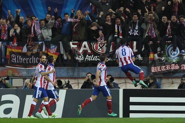 Aktuell Fussball, Champions League, Atletico Madrid - Atletico de Madrid Midfielder, Raul Garcia Escudero - RAUL GARCIA, number 8 celebrates after scoring a goal (1,0). Atletico de Madrid Midfielder, Arda Turan - ARDA, number 10. Atletico de Madrid Midfielder, Grabiel Fenandez Arenas - GABI, number 14. Atletico de Madrid Defender, Juan Francisco Torres Belen - JUANFRAN, number 20. Round 5 of the CHAMPIONS league soccer match between Atletico de Madrid - at the Vicente Calderon estadium Madrid - Spain by November 26 2014.