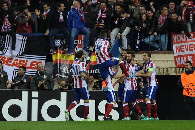 Aktuell Fussball, Champions League, Atletico Madrid - Atletico de Madrid Midfielder, Raul Garcia Escudero - RAUL GARCIA, number 8 celebrates after scoring a goal (1,0). Atletico de Madrid Midfielder, Arda Turan - ARDA, number 10. Atletico de Madrid Midfielder, Grabiel Fenandez Arenas - GABI, number 14. Atletico de Madrid Defender, Juan Francisco Torres Belen - JUANFRAN, number 20. Round 5 of the CHAMPIONS league soccer match between Atletico de Madrid - at the Vicente Calderon estadium Madrid - Spain by November 26 2014.