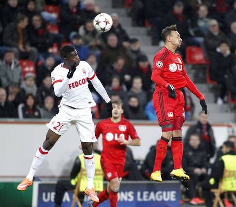 Monacos Elderson (L) jumps for a header against Leverkusens Karim Bellarabi during the Championsleague match between Bayer 04 Leverkusen and AS Monaco, Bayarena in Leverkusen on November 26., 2014. Bayer 04 Leverkusen vs. AS Monaco in der Champions League der Saison 2014 2015 am 26. November 2014.