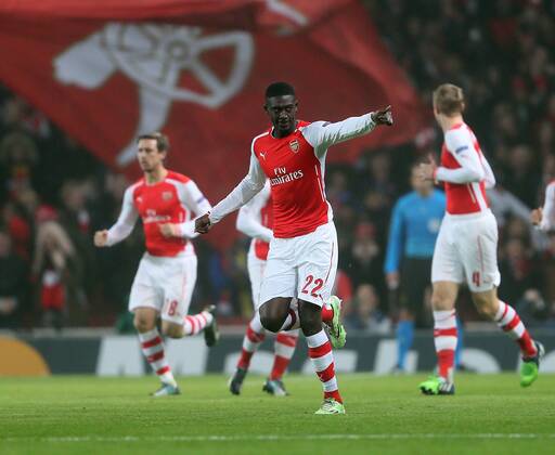 Arsenal s Yaya Sanogo celebrates scoring his sides opening goal UEFA Champions League- Arsenal vs Borussia Dortmund- Emirates Stadium - England - 26th November 2014 - EDITORIAL USE ONLY. No use with unauthorised audio, video, data, fixture lists, club league logos or live services. Online in-match use limited to 120 images, no video emulation. No use in betting, games or single club league player publications.