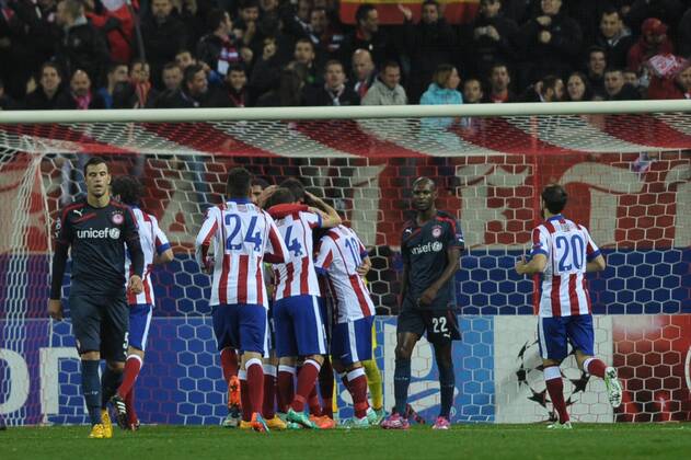 Aktuell Fussball, Champions League, Atletico Madrid - Olympiakos Piräus Atletico de Madrid Forward, Mario Mandzukic - MANDZUKIC, number 9 celebrates after scoring a goal (2,0). Atletico de Madrid Midfielder, Tiago Cardoso Mendes - TIAGO, number 5. Atletico de Madrid Midfielder, Arda Turan - ARDA, number 10. Atletico de Madrid Midfielder, Grabiel Fenandez Arenas - GABI, number 14. Atletico de Madrid Midfielder, Cristian Daniel Ansaldi - ANSALDI, number 15. Atletico de Madrid Defender, Jose Maria Gimenez de Vargas - GIMENEZ, number 24. Olympiacos FC Midfielder, Luka Milivojevic - MILIVOJEVIC, number 5. Olympiacos FC Defender, Erik Abidal - ABIDAL, number 22. Round 5 of the CHAMPIONS league soccer match between Atletico de Madrid - Olympiacos FC at the Vicente Calderon estadium Madrid - Spain by November 26 2014.