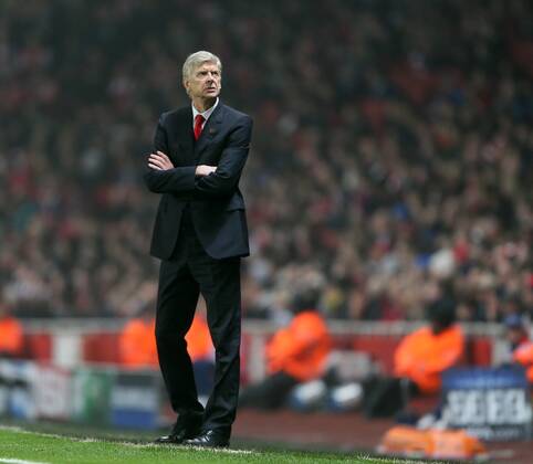 Arsenal s Arsene Wenger looks on UEFA Champions League- Arsenal vs Borussia Dortmund- Emirates Stadium - England - 26th November 2014 - EDITORIAL USE ONLY. No use with unauthorised audio, video, data, fixture lists, club league logos or live services. Online in-match use limited to 120 images, no video emulation. No use in betting, games or single club league player publications.