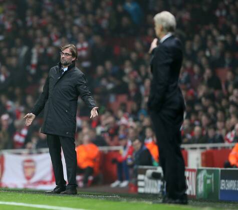 Dortmund s Jurgen Klopp looks on dejected UEFA Champions League- Arsenal vs Borussia Dortmund- Emirates Stadium - England - 26th November 2014 - EDITORIAL USE ONLY. No use with unauthorised audio, video, data, fixture lists, club league logos or live services. Online in-match use limited to 120 images, no video emulation. No use in betting, games or single club league player publications.