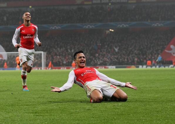 Arsenal s Alexis Sanchez celebrates scoring his sides second goal UEFA Champions League- Arsenal vs Borussia Dortmund- Emirates Stadium - England - 26th November 2014 - EDITORIAL USE ONLY. No use with unauthorised audio, video, data, fixture lists, club league logos or live services. Online in-match use limited to 120 images, no video emulation. No use in betting, games or single club league player publications.