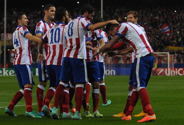 Atletico de Madrid Forward, Mario Mandzukic - MANDZUKIC, number 9 celebrates after scoring a goal (4,0). Atletico de Madrid Defender, Diego Roberto Godin Leal - GODIN, number 2. Atletico de Madrid Midfielder, Raul Garcia Escudero - RAUL GARCIA, number 8. Atletico de Madrid Defender, Juan Francisco Torres Belen - JUANFRAN, number 20. Atletico de Madrid Defender, Jose Maria Gimenez de Vargas - GIMENEZ, number 24. Round 5 of the CHAMPIONS league soccer match between Atletico de Madrid - Olympiacos FC at the Vicente Calderon estadium Madrid - Spain by November 26 2014.