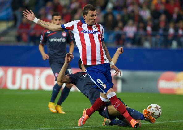 Atletico de Madrid Forward, Mario Mandzukic - MANDZUKIC, number 9 . Round 5 of the CHAMPIONS league, soccer match between Atletico de Madrid - OLYMPIACOS at the Vicente Calderon stadium, Madrid - Spain by November 26, 2014. . 