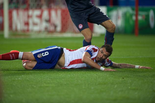 Atletico de Madrid Forward, Mario Mandzukic - MANDZUKIC, number 9 . Round 5 of the CHAMPIONS league, soccer match between Atletico de Madrid - OLYMPIACOS at the Vicente Calderon stadium, Madrid - Spain by November 26, 2014. . 