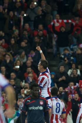 Atletico de Madrid Forward, Mario Mandzukic - MANDZUKIC, number 9 celebrates after scoring a goal (4,0). Round 5 of the CHAMPIONS league, soccer match between Atletico de Madrid - OLYMPIACOS at the Vicente Calderon stadium, Madrid - Spain by November 26, 2014. . 